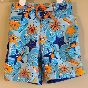 UV Skinz blue and orange mesh lined swim trunks